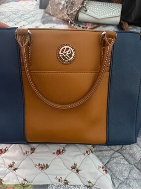 Kim Rodger’s Navy and Tan Structured Satchel with Logo Accent